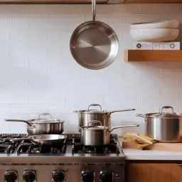 A collection of Made In cookware on a stove