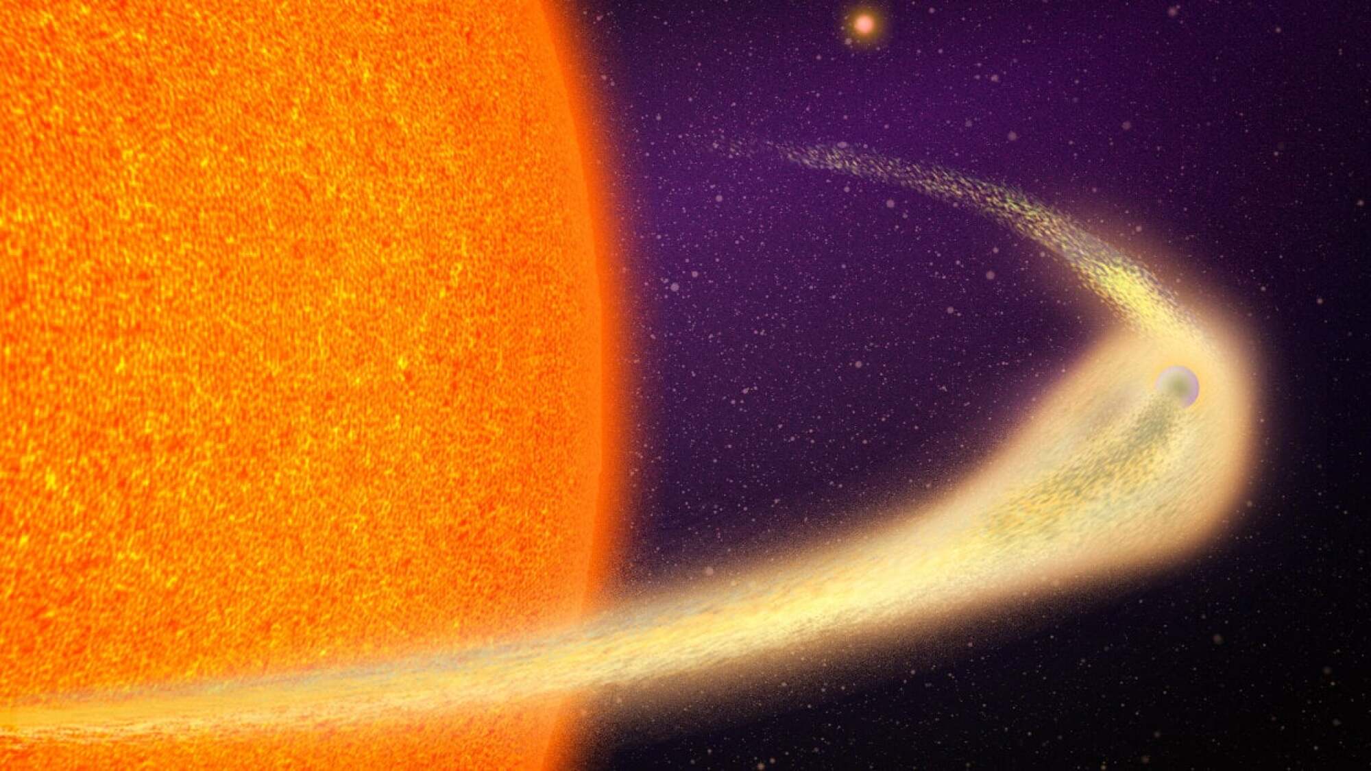 An artist's rendering of an exoplanet with a comet-like tail