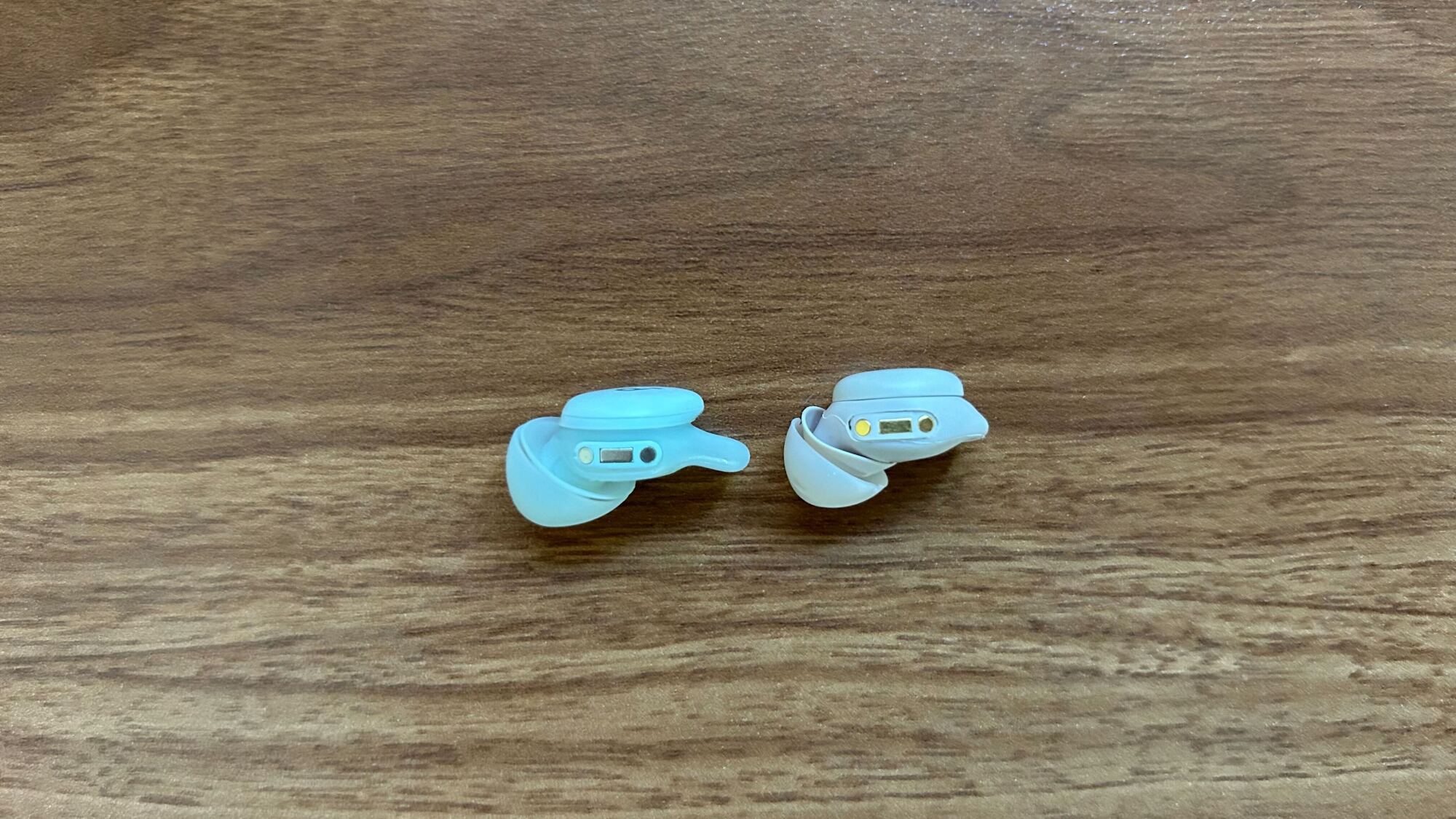 sleep a30 earbud next to sleep a20 earbud on desktop