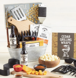 Father's Day-themed gift basket featuring grilling utensils, sauces, and more