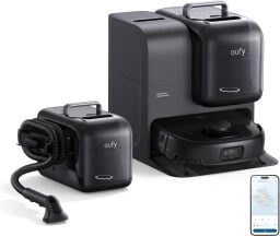 Eufy 28 robot vacuum and carpet cleaner beside smartphone with cleaning app on screen